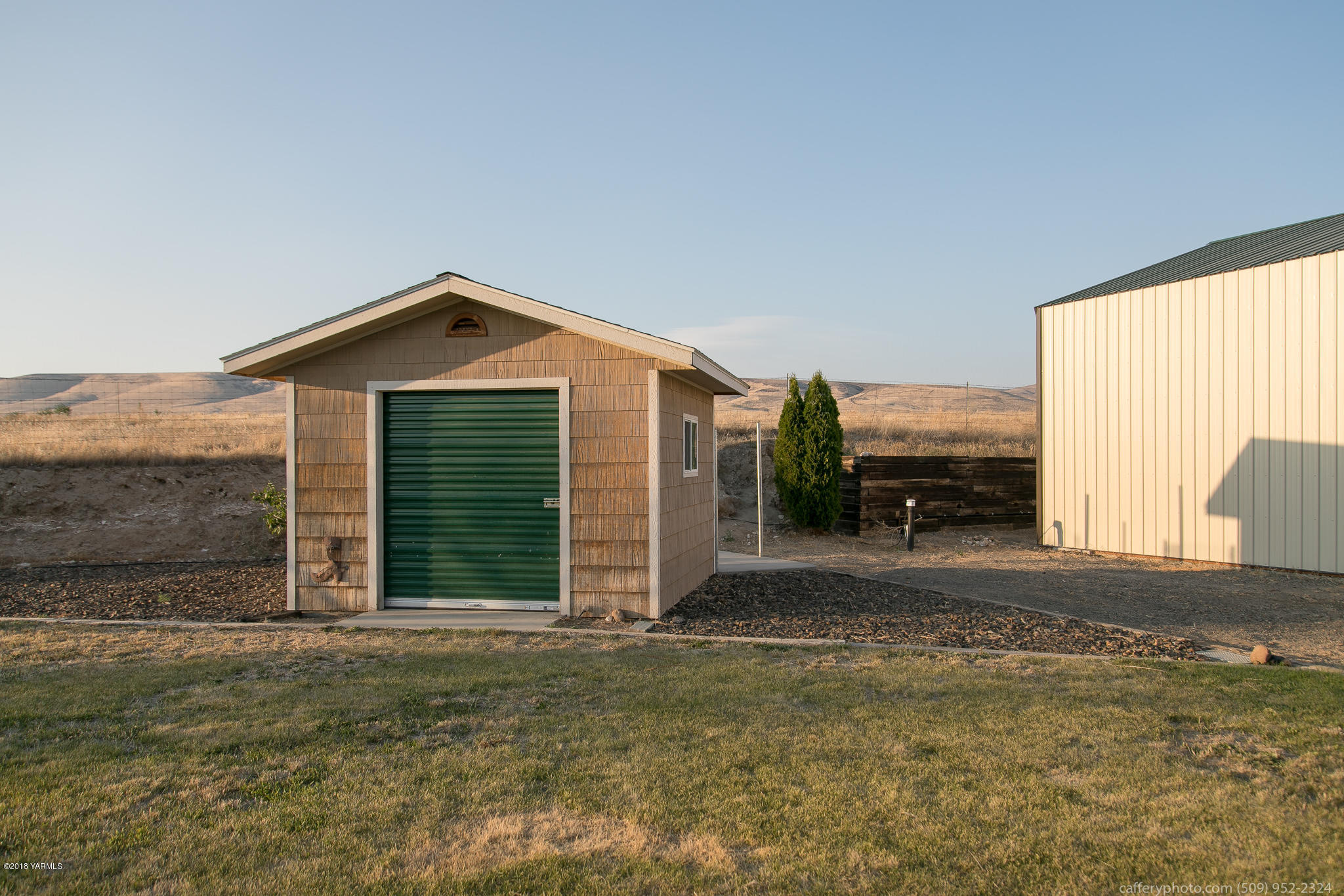 11517 Mieras Road Yakima, WA 98901 - Photo 16 of 57 a view of a house with a yard