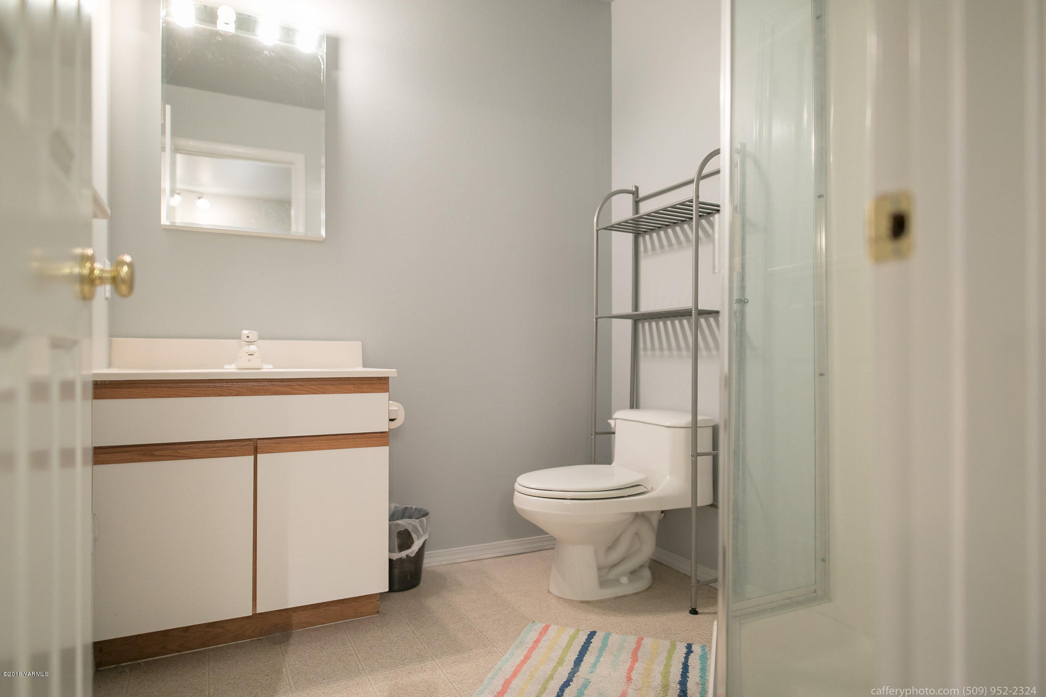 11517 Mieras Road Yakima, WA 98901 - Photo 23 of 57 a bathroom with a sink toilet and shower