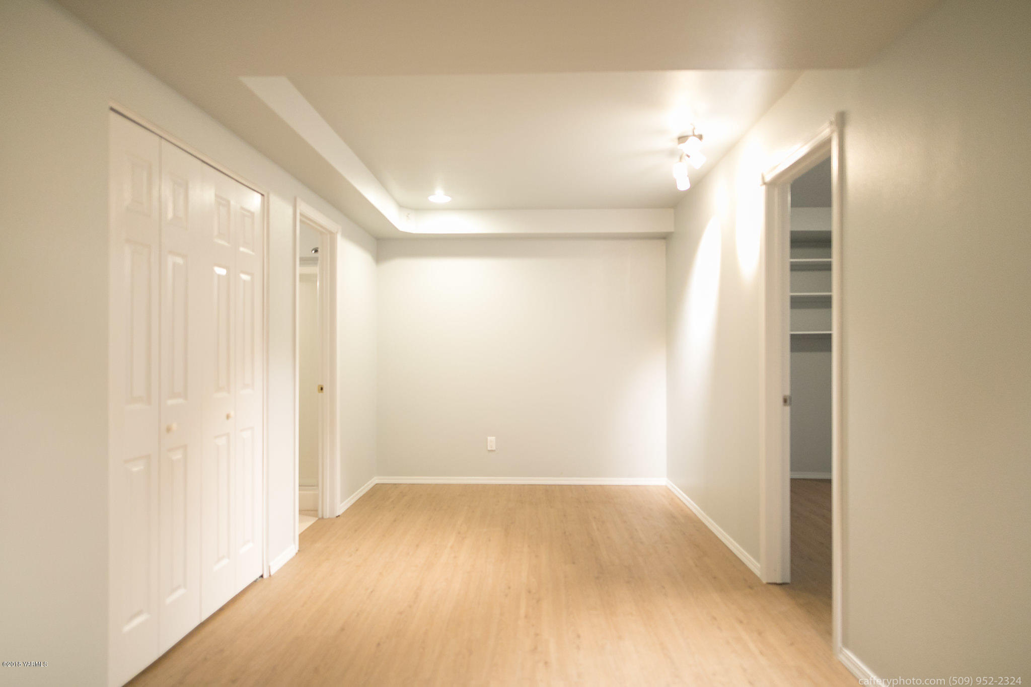 11517 Mieras Road Yakima, WA 98901 - Photo 25 of 57 a view of hallway with a large window and chandelier fan