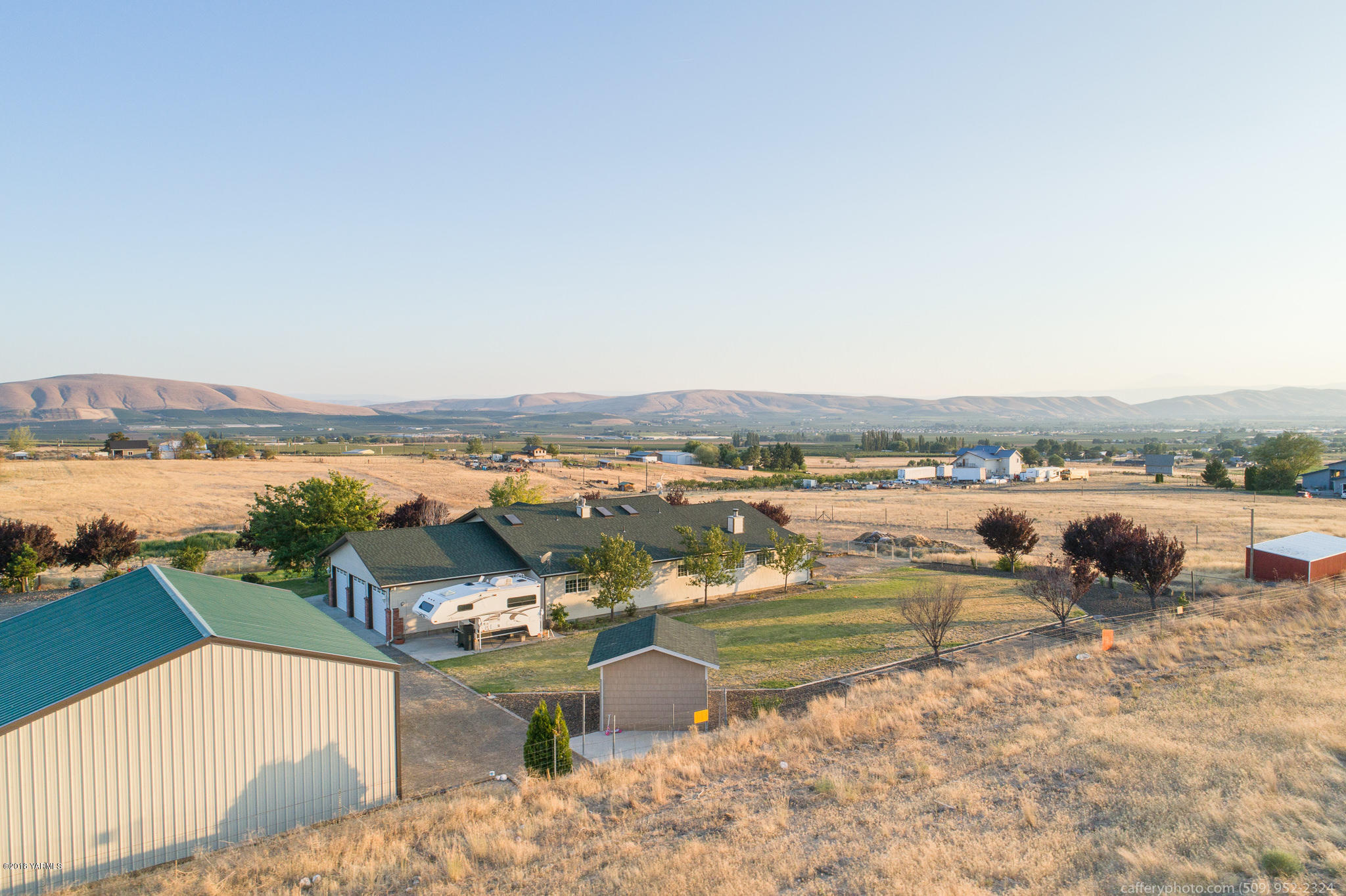 11517 Mieras Road Yakima, WA 98901 - Photo 4 of 57 an aerial view of a house with lake view