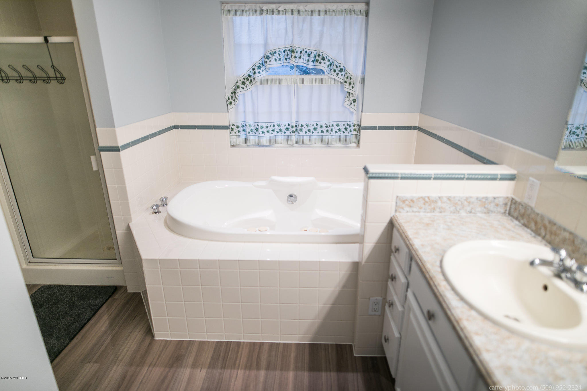 11517 Mieras Road Yakima, WA 98901 - Photo 38 of 57 a bathroom with a sink and a mirror