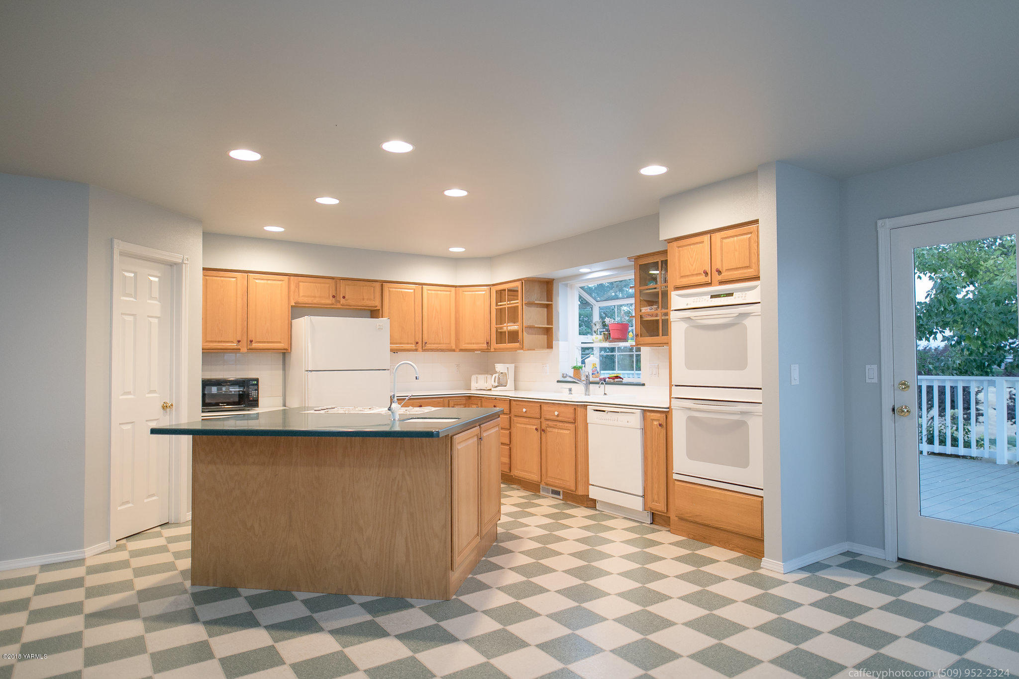 11517 Mieras Road Yakima, WA 98901 - Photo 44 of 57 a kitchen with stainless steel appliances granite countertop a sink and a refrigerator