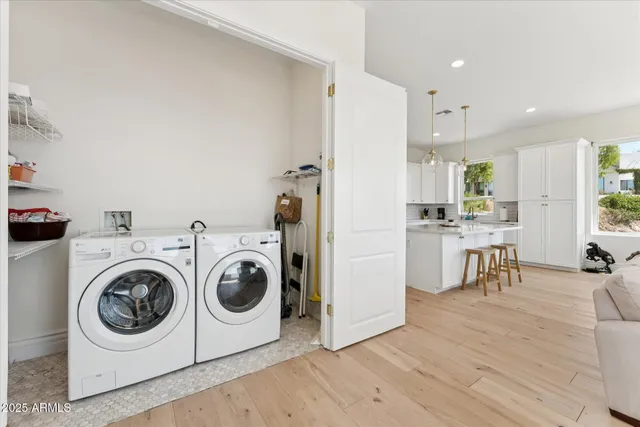 a view of kitchen and utility room with wooden floor