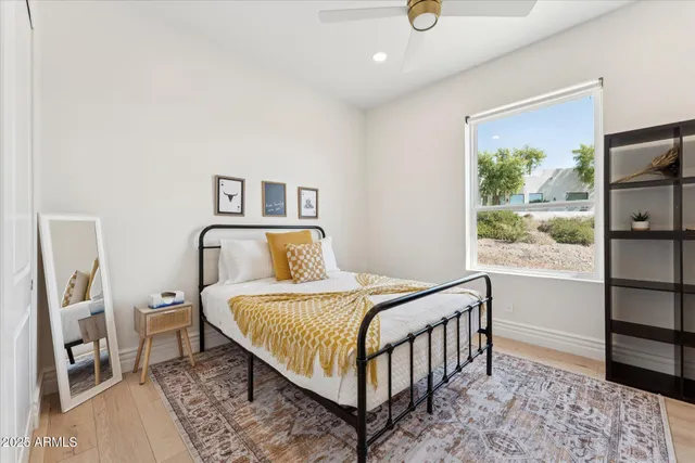 a bedroom with a bed and a window