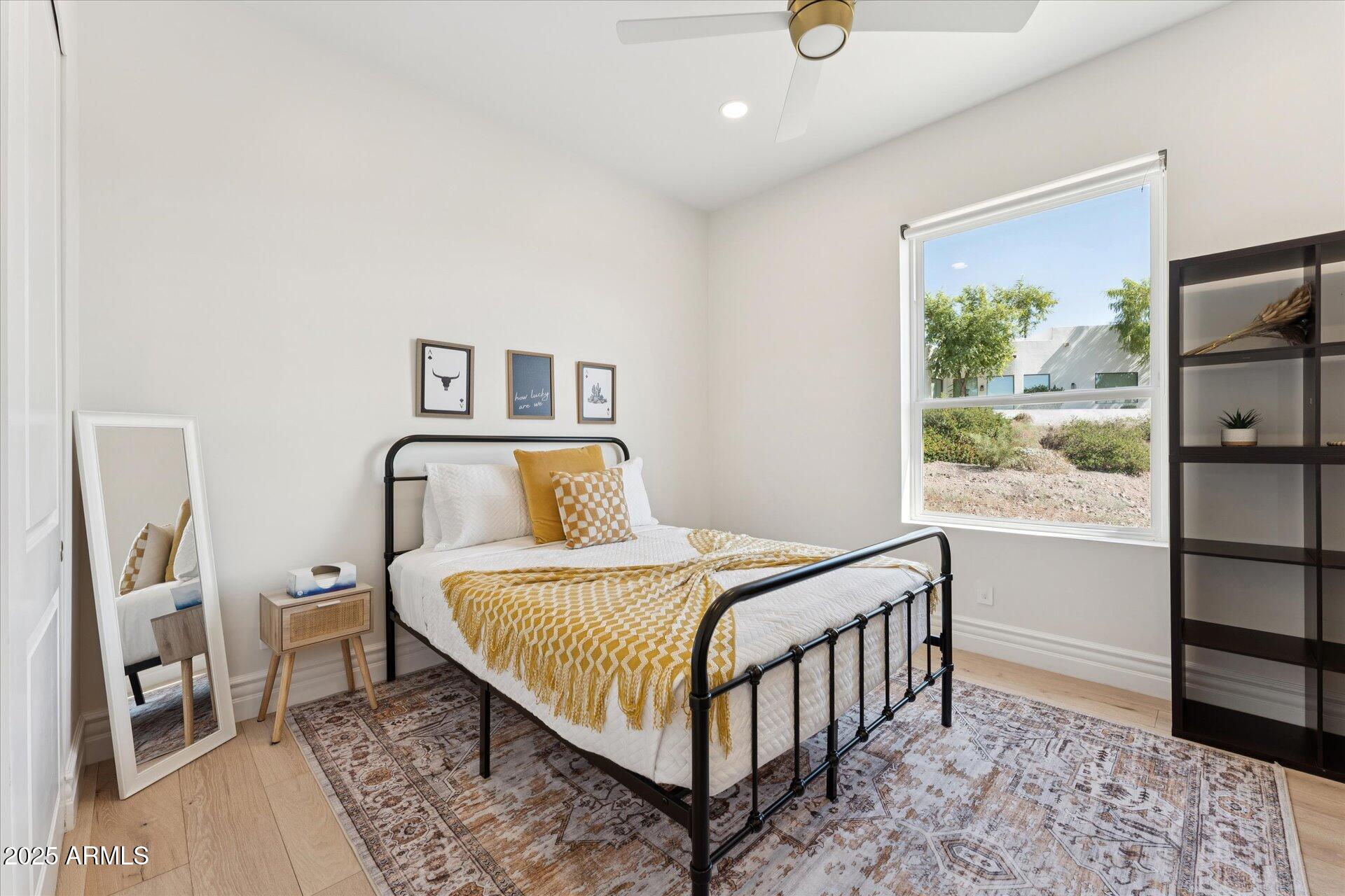 221 West Jomax Road, Unit 1 Phoenix, AZ 85085 - Photo 16 of 26 a bedroom with a bed and a window