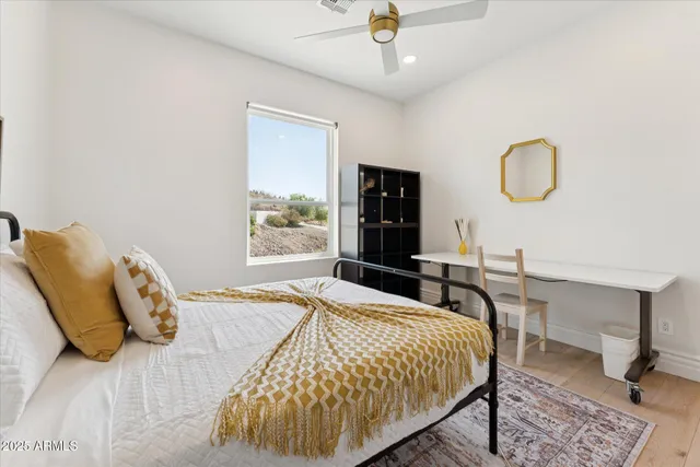 a bedroom with a bed and window