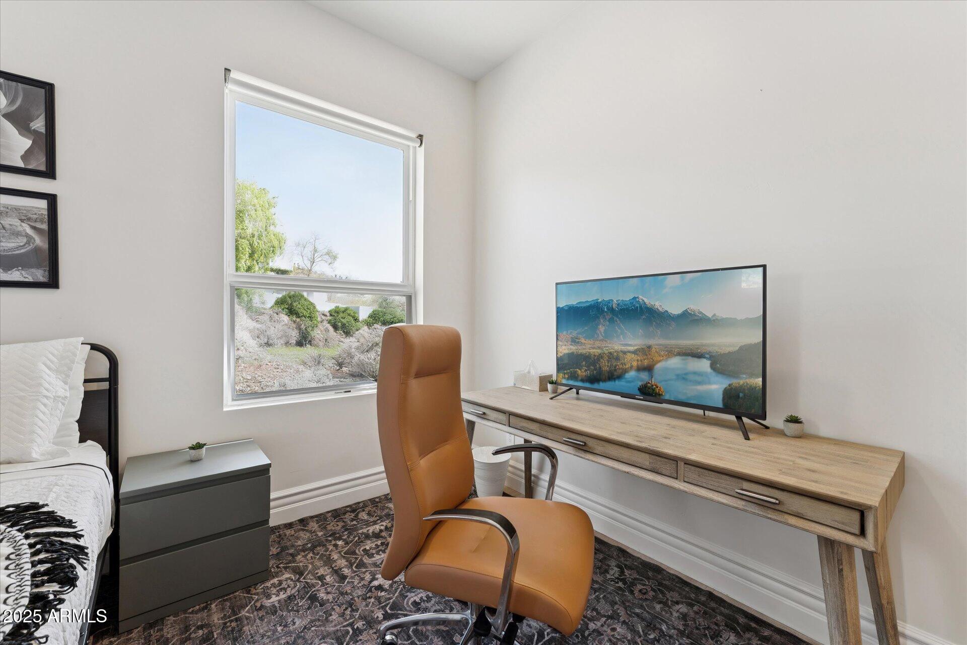 221 West Jomax Road, Unit 1 Phoenix, AZ 85085 - Photo 21 of 26 a living room with furniture and a flat screen tv