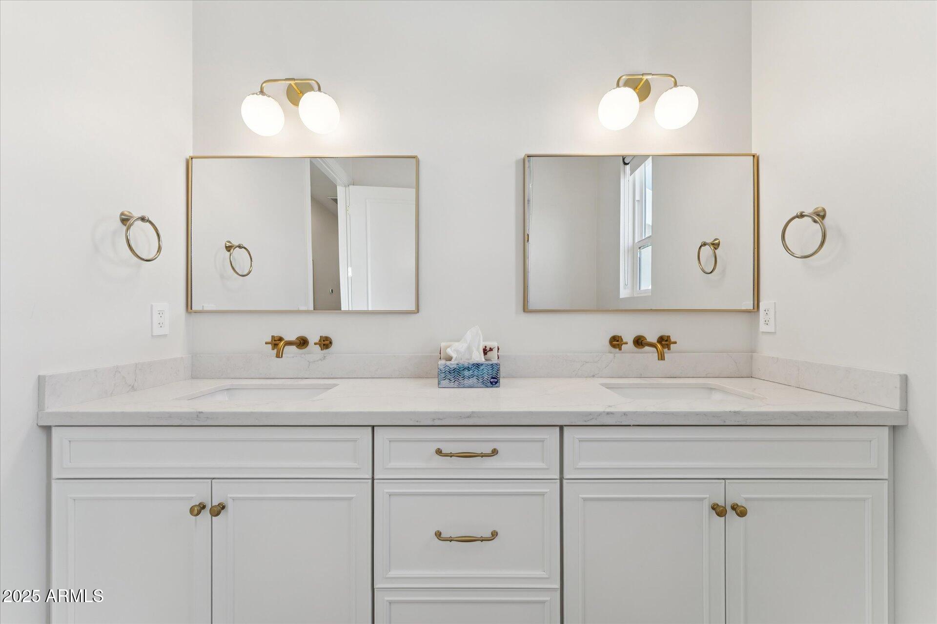 221 West Jomax Road, Unit 1 Phoenix, AZ 85085 - Photo 23 of 26 a bathroom with a sink vanity and mirror