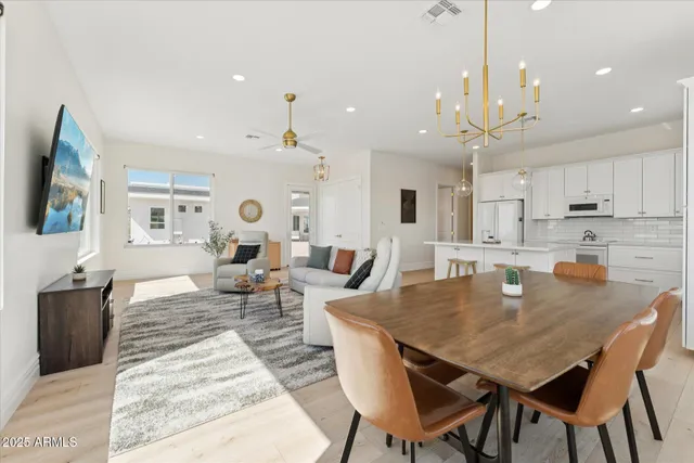 a large kitchen with a table and chairs