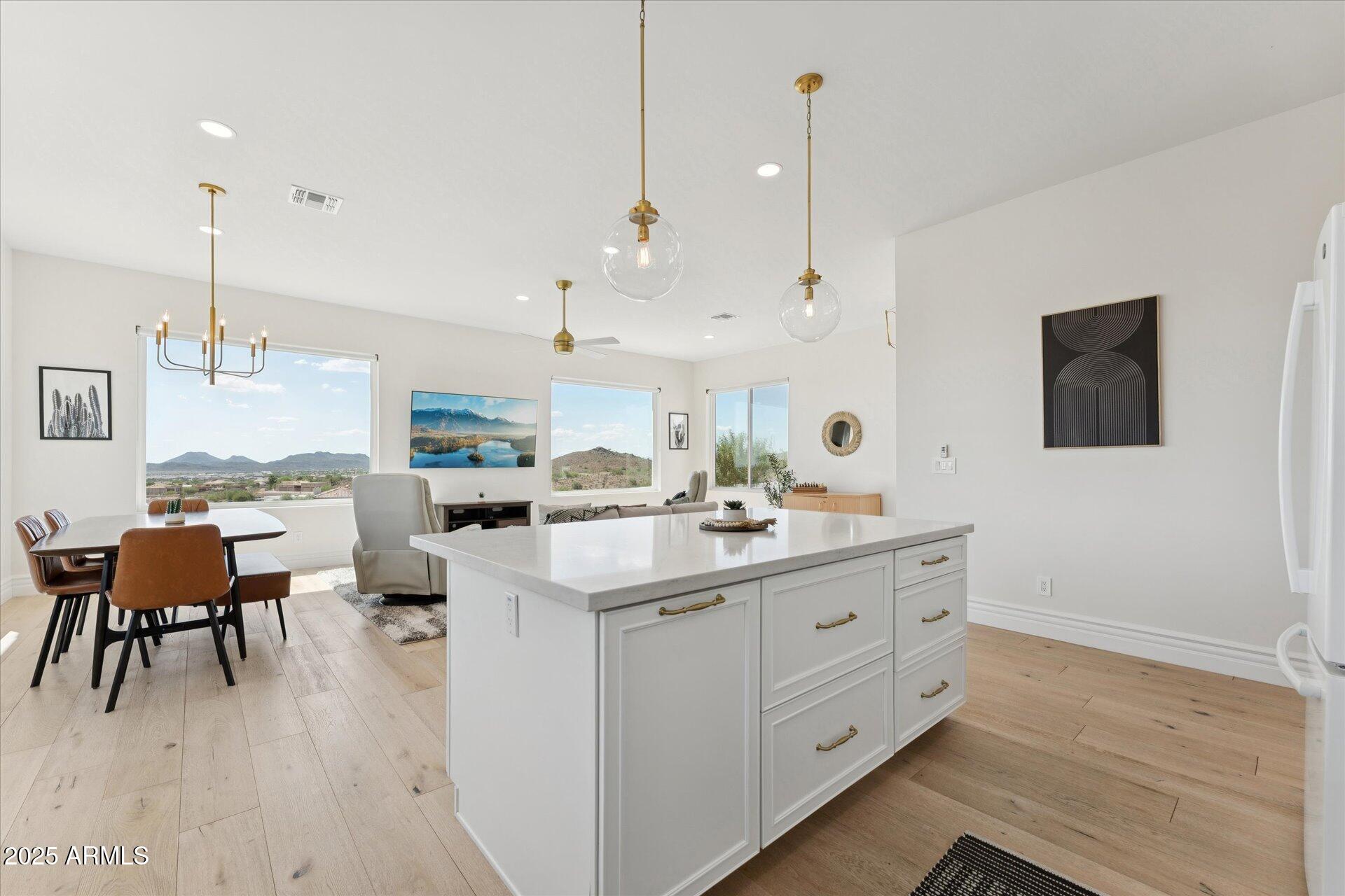 221 West Jomax Road, Unit 1 Phoenix, AZ 85085 - Photo 4 of 26 a kitchen with a sink cabinets and wooden floor