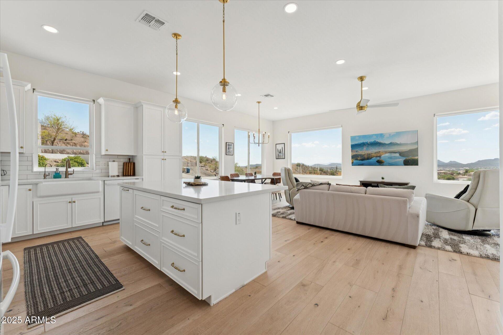 221 West Jomax Road, Unit 1 Phoenix, AZ 85085 - Photo 7 of 26 a large white kitchen with cabinets