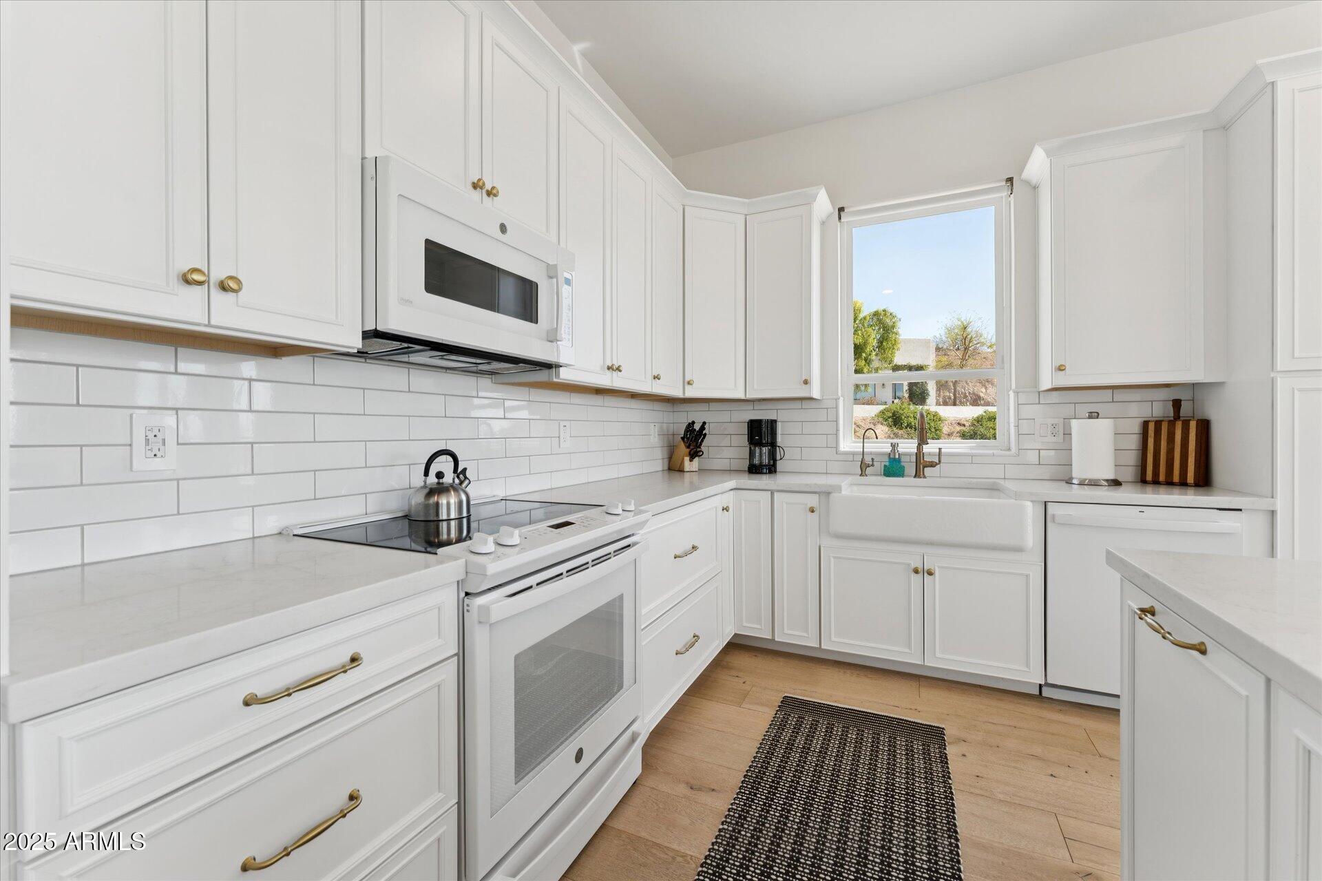 221 West Jomax Road, Unit 1 Phoenix, AZ 85085 - Photo 10 of 26 a kitchen with appliances cabinets and a sink