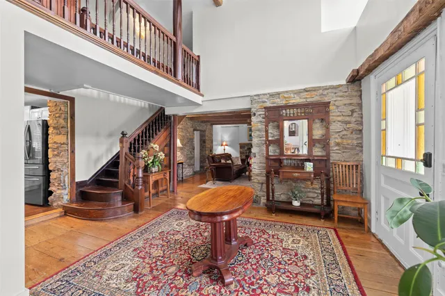 a living room with furniture and a rug