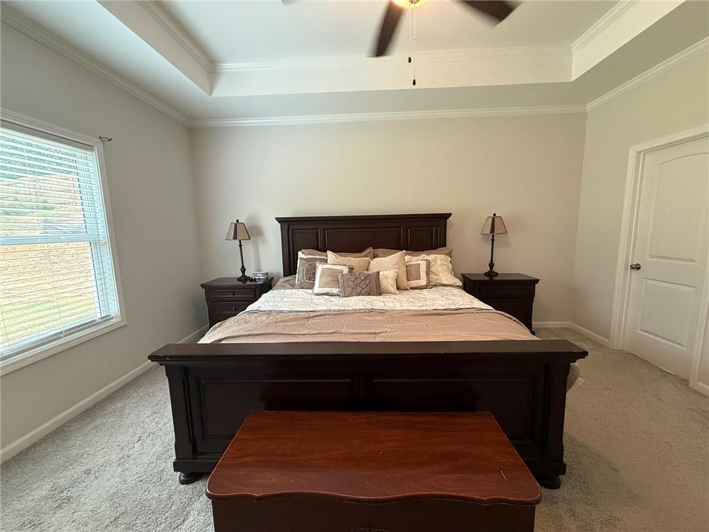 358 Mulberry Road Winder, GA 30680 - Photo 17 of 21 a bed sitting in a bedroom next to a window