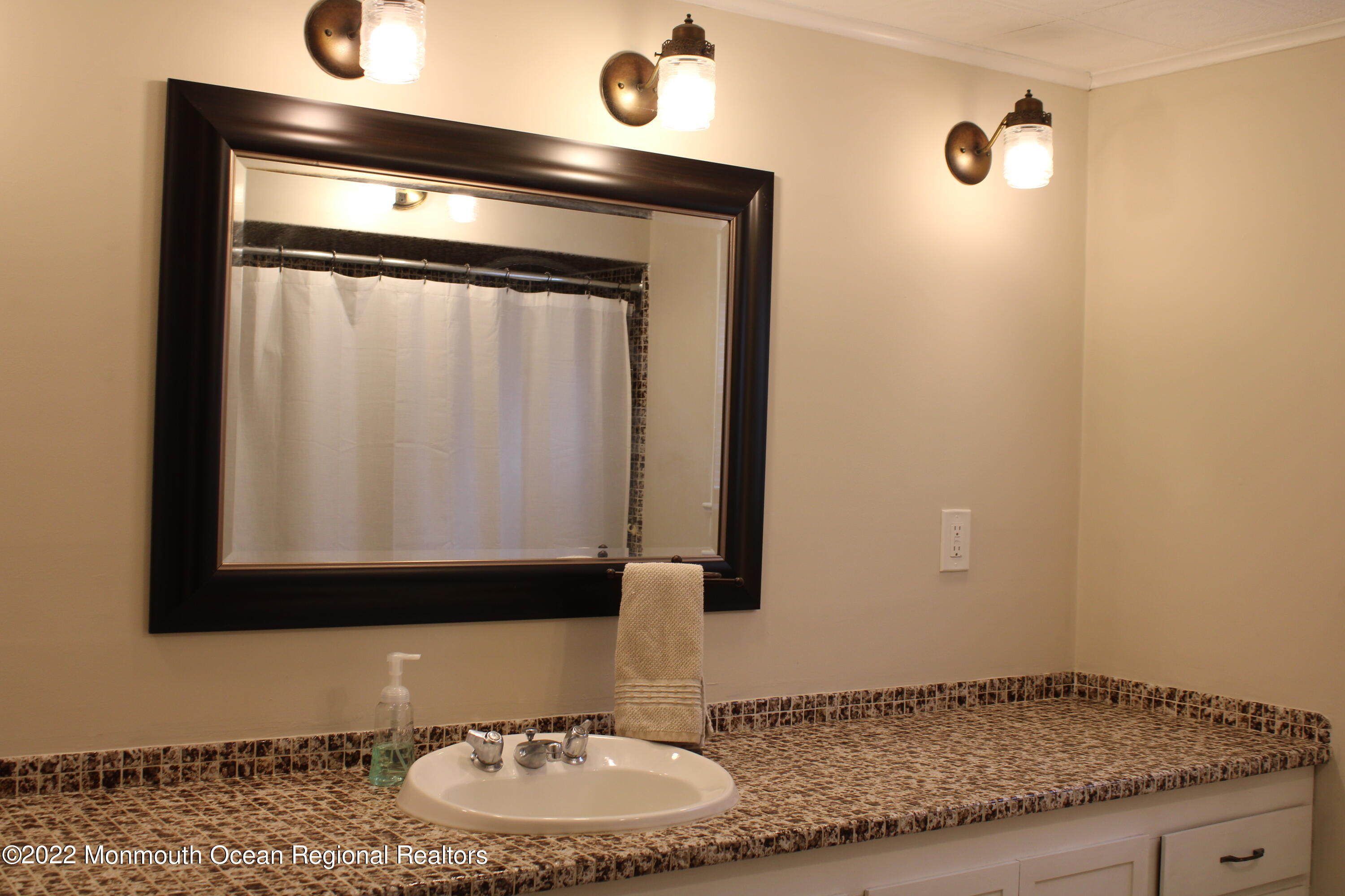 2001 Diana Road Wall, NJ 07719 - Photo 18 of 39 a bathroom with a granite countertop sink and a mirror