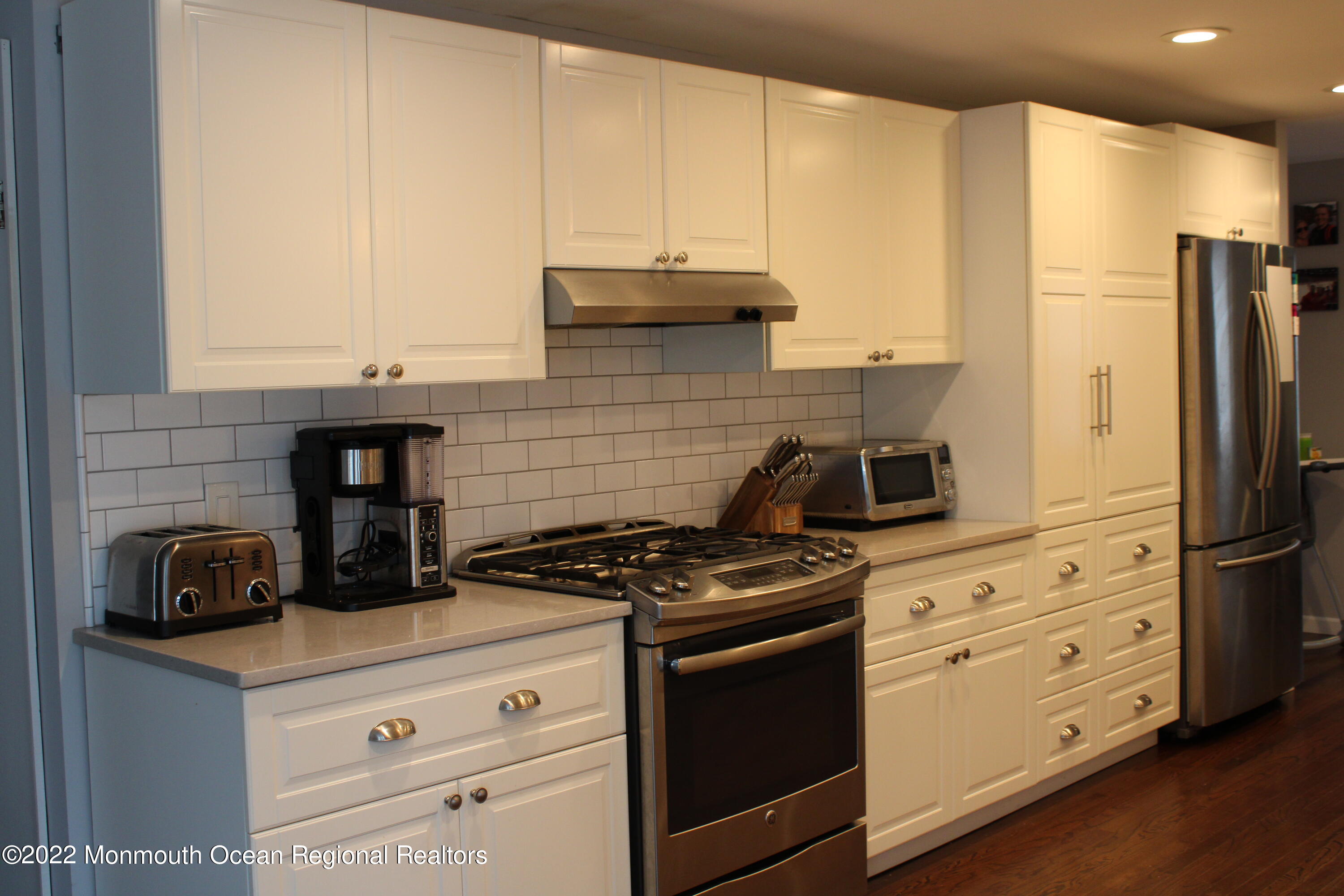 2001 Diana Road Wall, NJ 07719 - Photo 10 of 39 a kitchen with stainless steel appliances granite countertop a stove a refrigerator and a white cabinets