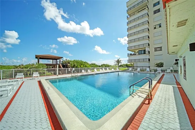a view of a lake with a large pool