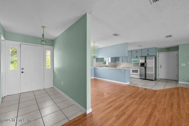 a view of kitchen with wooden floor