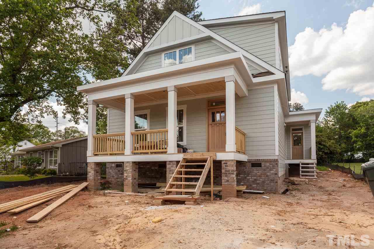 309 Georgetown Road Raleigh, NC 27608 - Photo 1 of 19 a front view of a house with a yard