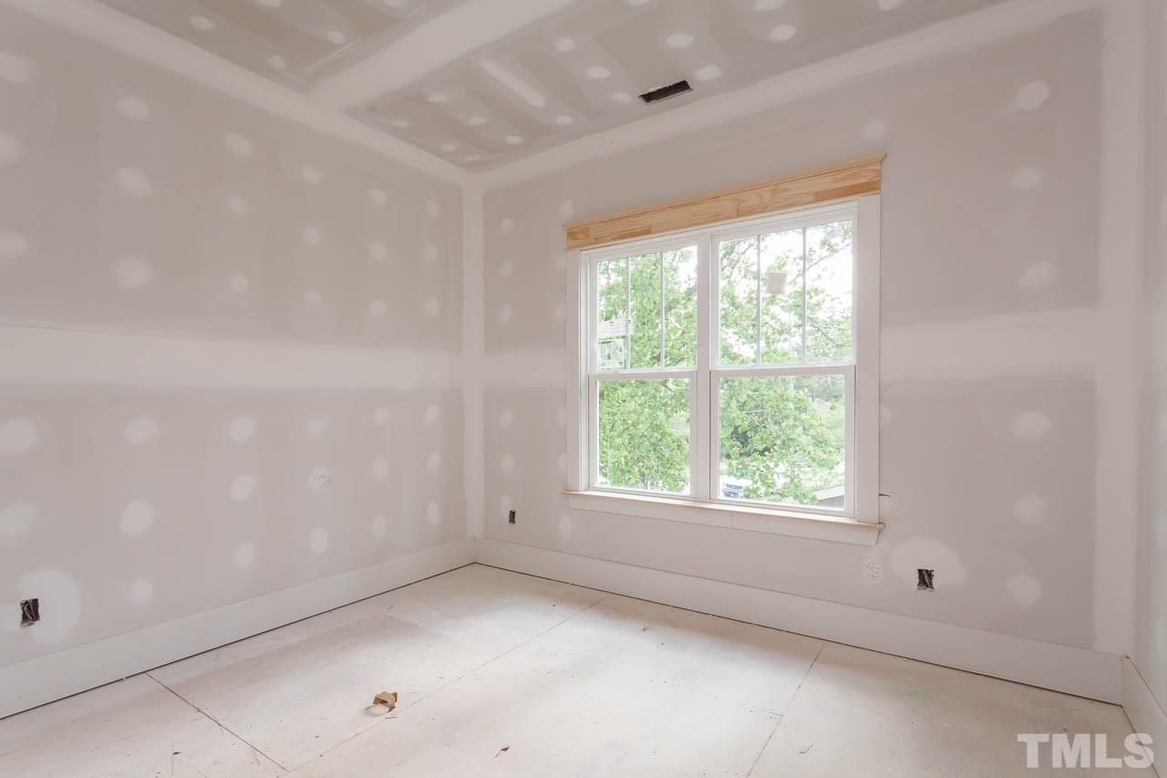 309 Georgetown Road Raleigh, NC 27608 - Photo 12 of 19 an empty room with a window