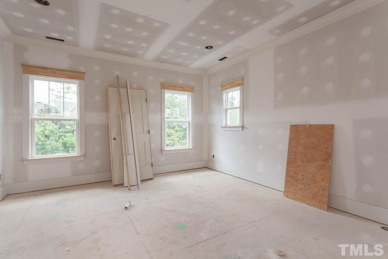 309 Georgetown Road Raleigh, NC 27608 - Photo 13 of 19 an empty room with windows