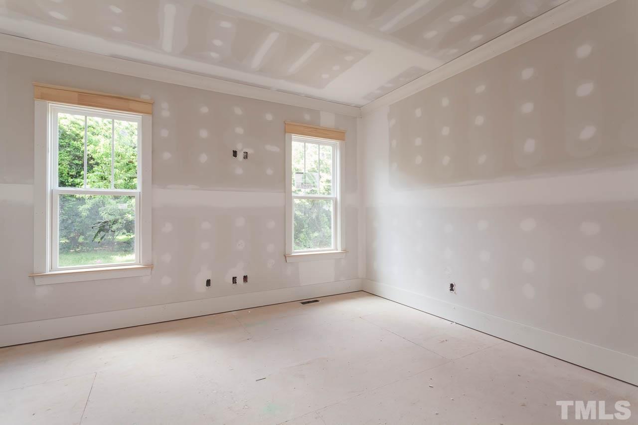 309 Georgetown Road Raleigh, NC 27608 - Photo 5 of 19 an empty room with a window