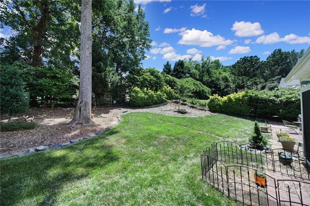 549 South Portman Lane Fort Mill, SC 29708 - Photo 33 of 39 a view of a garden with a tree in the background