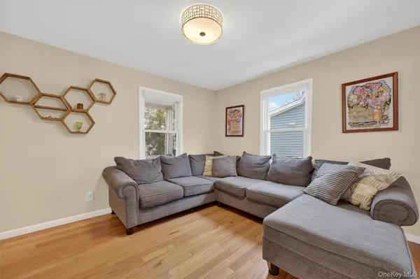 a living room with furniture and a window