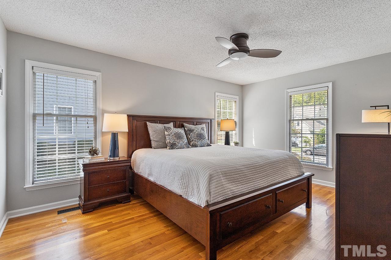 6103 Chesden Drive Durham, NC 27713 - Photo 12 of 22 a bed sitting in a bedroom next to a window