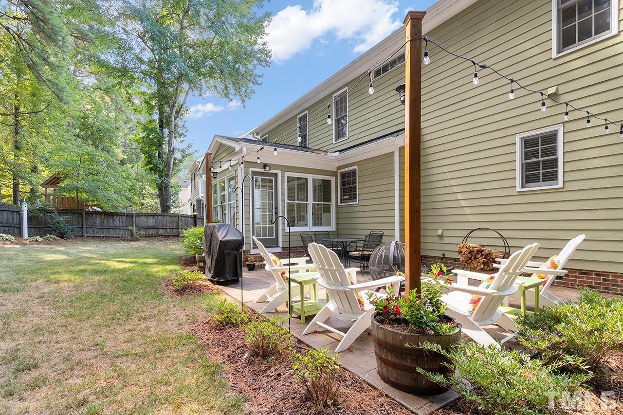 6103 Chesden Drive Durham, NC 27713 - Photo 19 of 22 a view of backyard with sitting area and garden