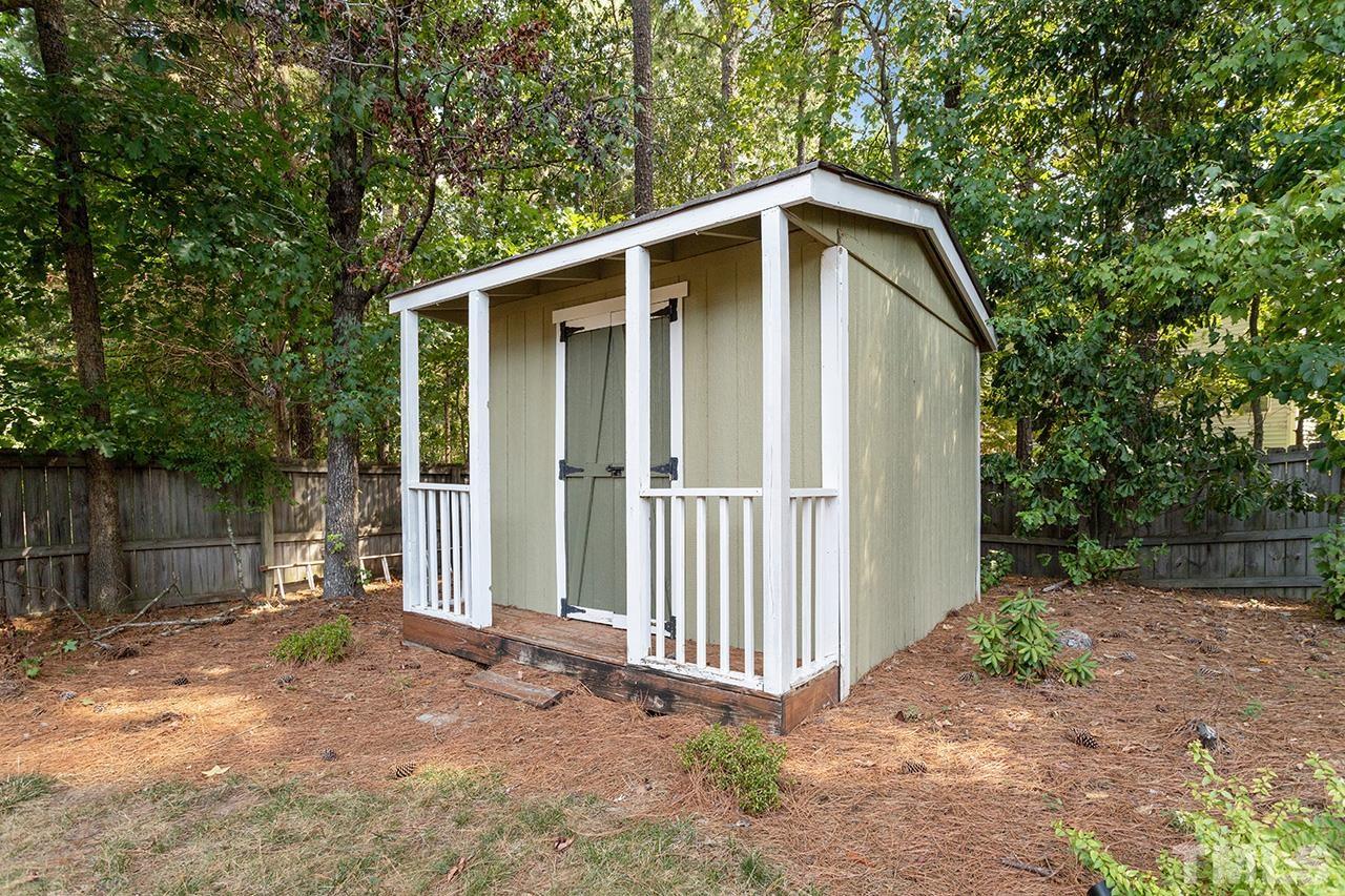 6103 Chesden Drive Durham, NC 27713 - Photo 22 of 22 a backyard of a house with lots of green space