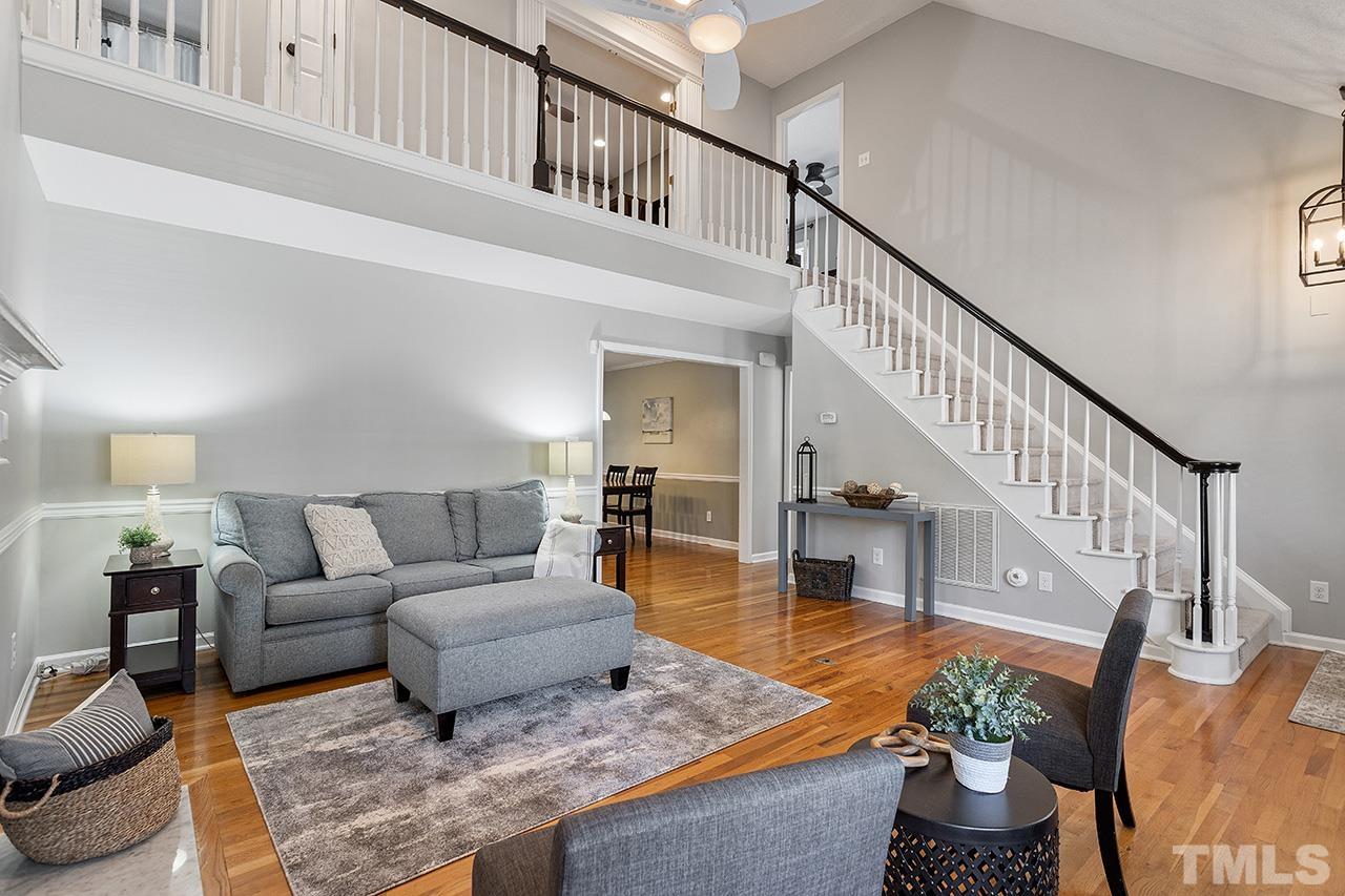 6103 Chesden Drive Durham, NC 27713 - Photo 5 of 22 a living room with furniture or stairs and a couch