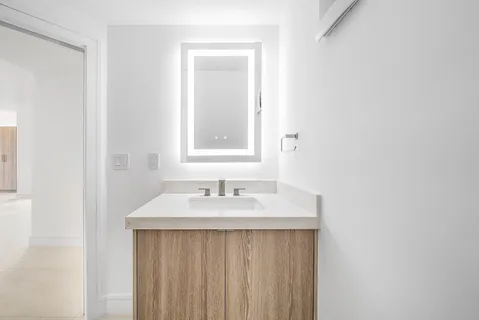 an empty room with a empty space and windows