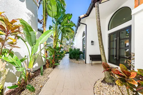 a backyard of a house with outdoor seating