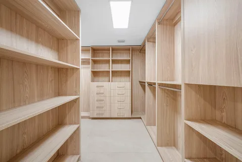 a bathroom with a double vanity sink mirror and shower