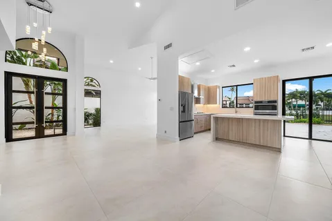 a kitchen with a refrigerator sink and stove