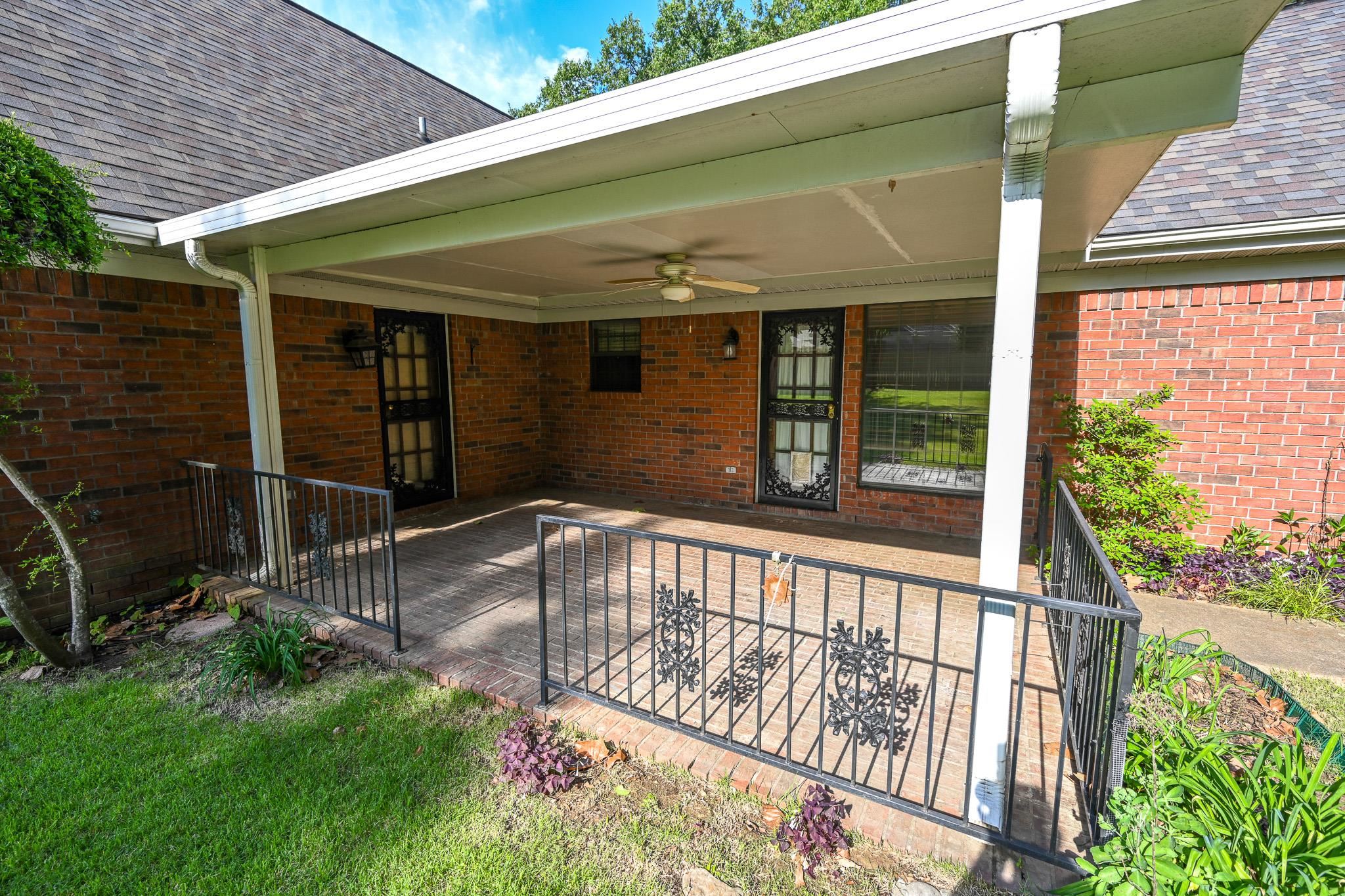3746 Broadway Road Bartlett, TN 38135 - Photo 33 of 39 Covered back patio with brick flooring and ceiling fan.