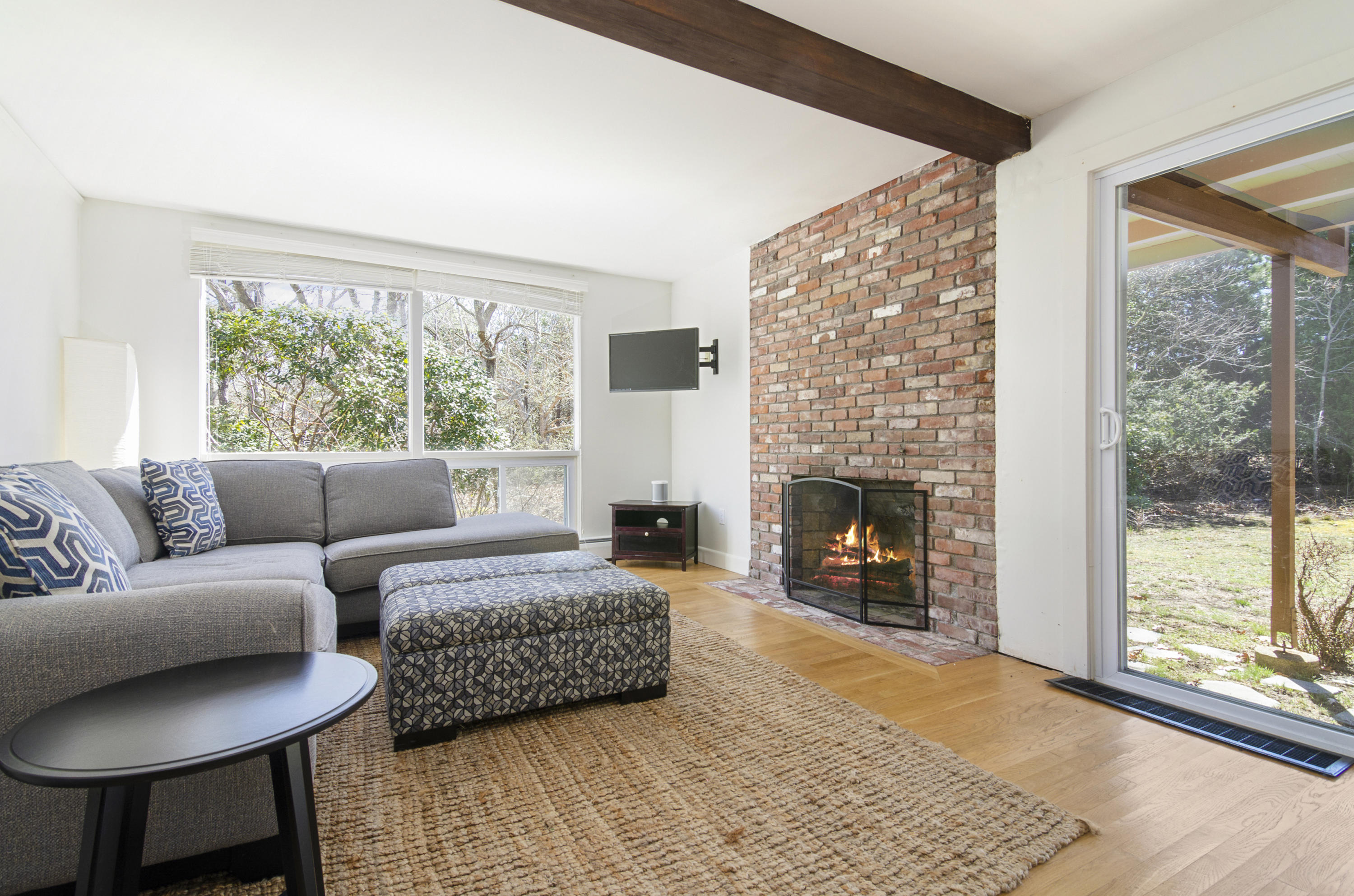 65 Pasture Road Cataumet, MA 02534 - Photo 13 of 26 a living room with furniture and a fireplace