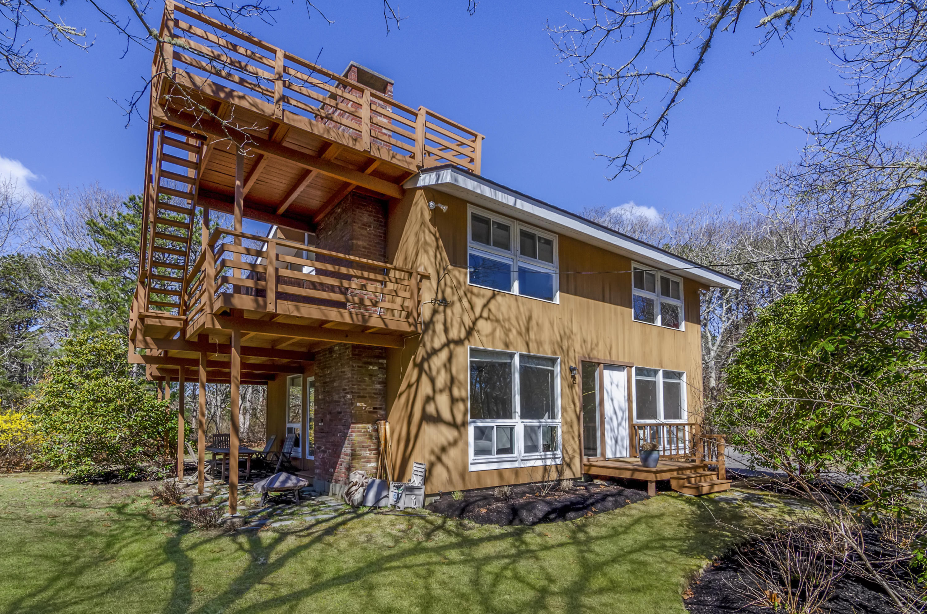 65 Pasture Road Cataumet, MA 02534 - Photo 4 of 26 front view of a house with a small yard