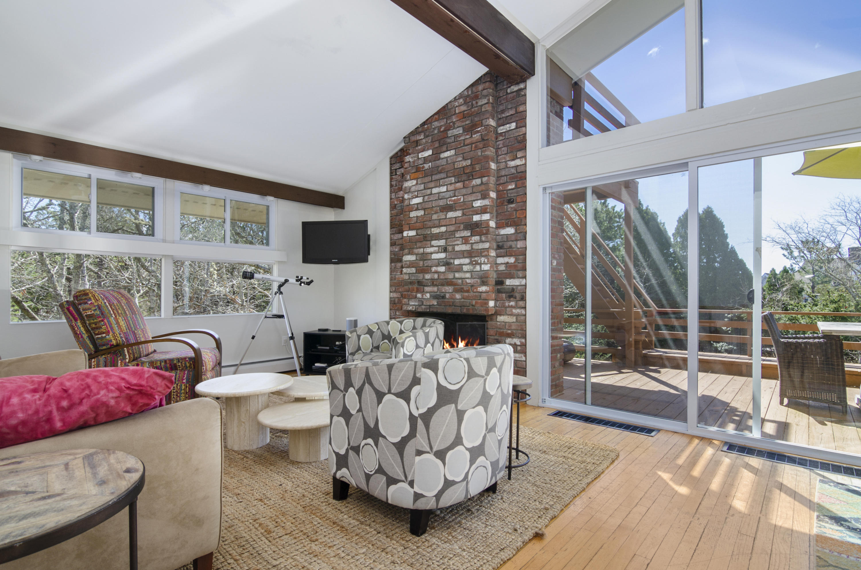 65 Pasture Road Cataumet, MA 02534 - Photo 8 of 26 a living room with furniture and a floor to ceiling window