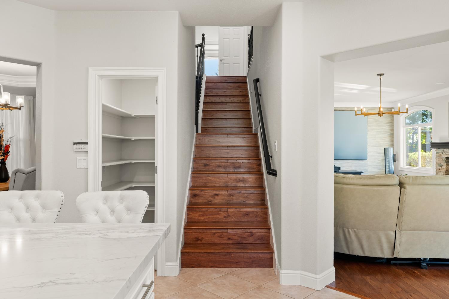 1580 Vista Ridge Way Roseville, CA 95661 - Photo 14 of 58 a hallway with white cabinets and wooden floor