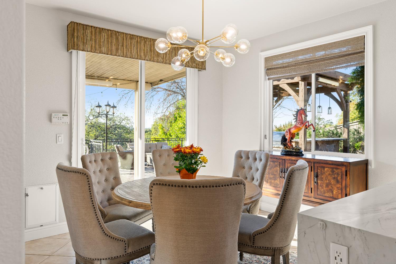 1580 Vista Ridge Way Roseville, CA 95661 - Photo 15 of 58 a dining room with furniture a livingroom and chandelier