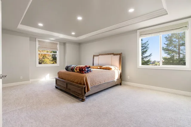 an empty room with chandelier fan