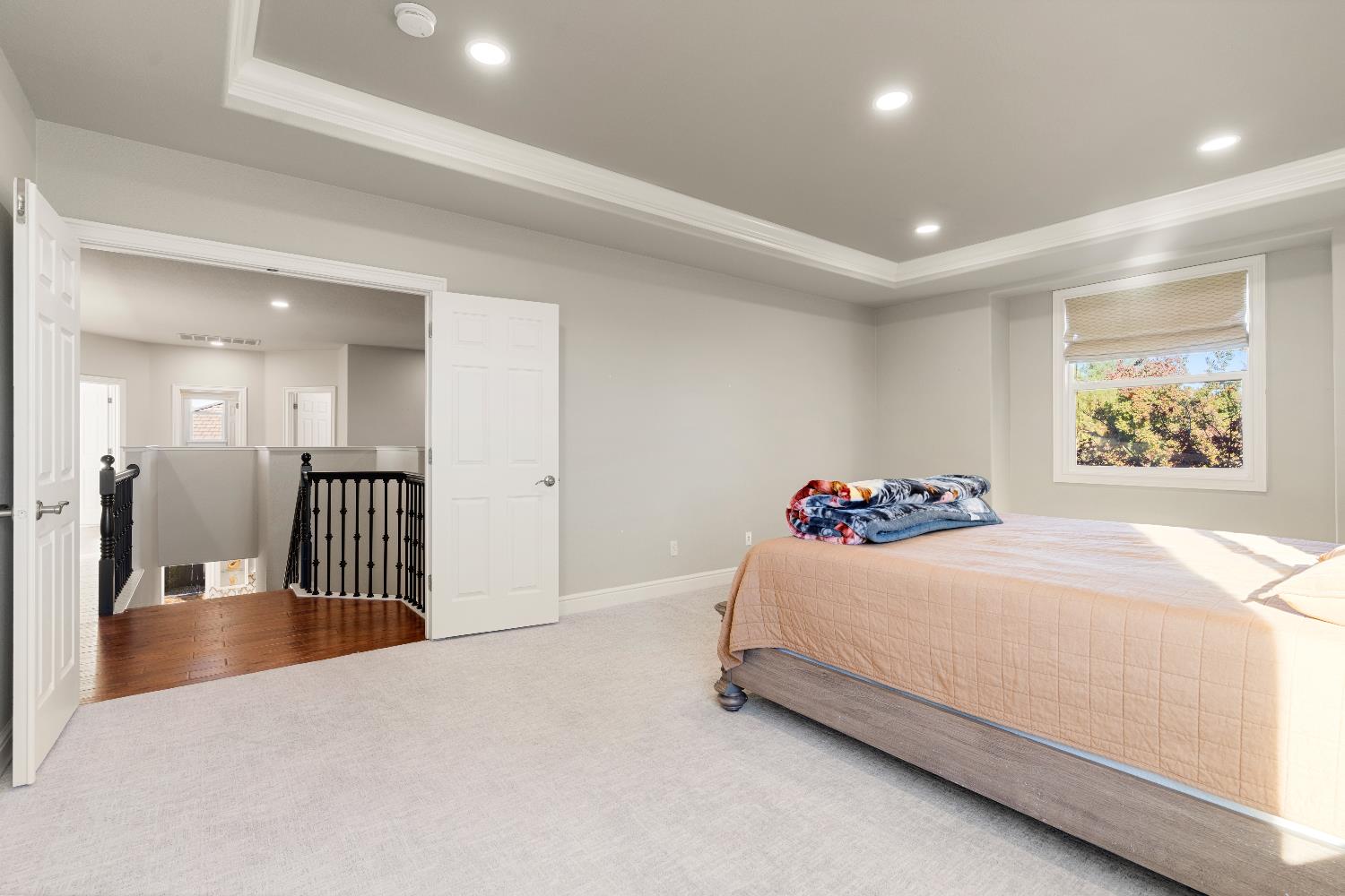 1580 Vista Ridge Way Roseville, CA 95661 - Photo 24 of 58 a bedroom with a bed and a chandelier