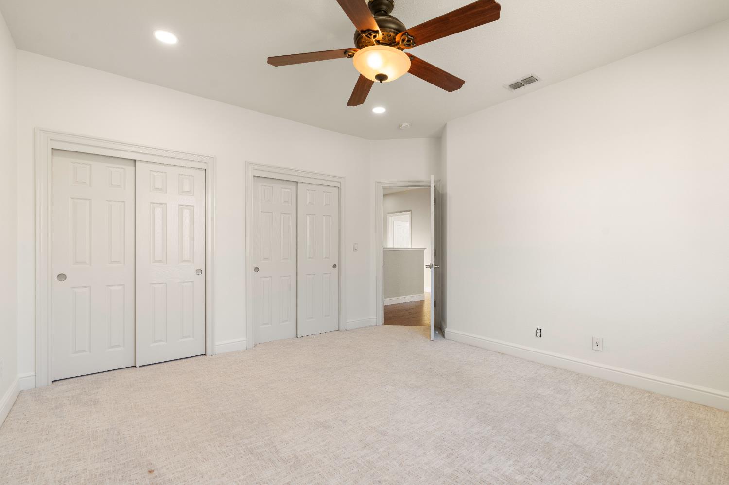 1580 Vista Ridge Way Roseville, CA 95661 - Photo 34 of 58 an empty room with closet and a ceiling fan