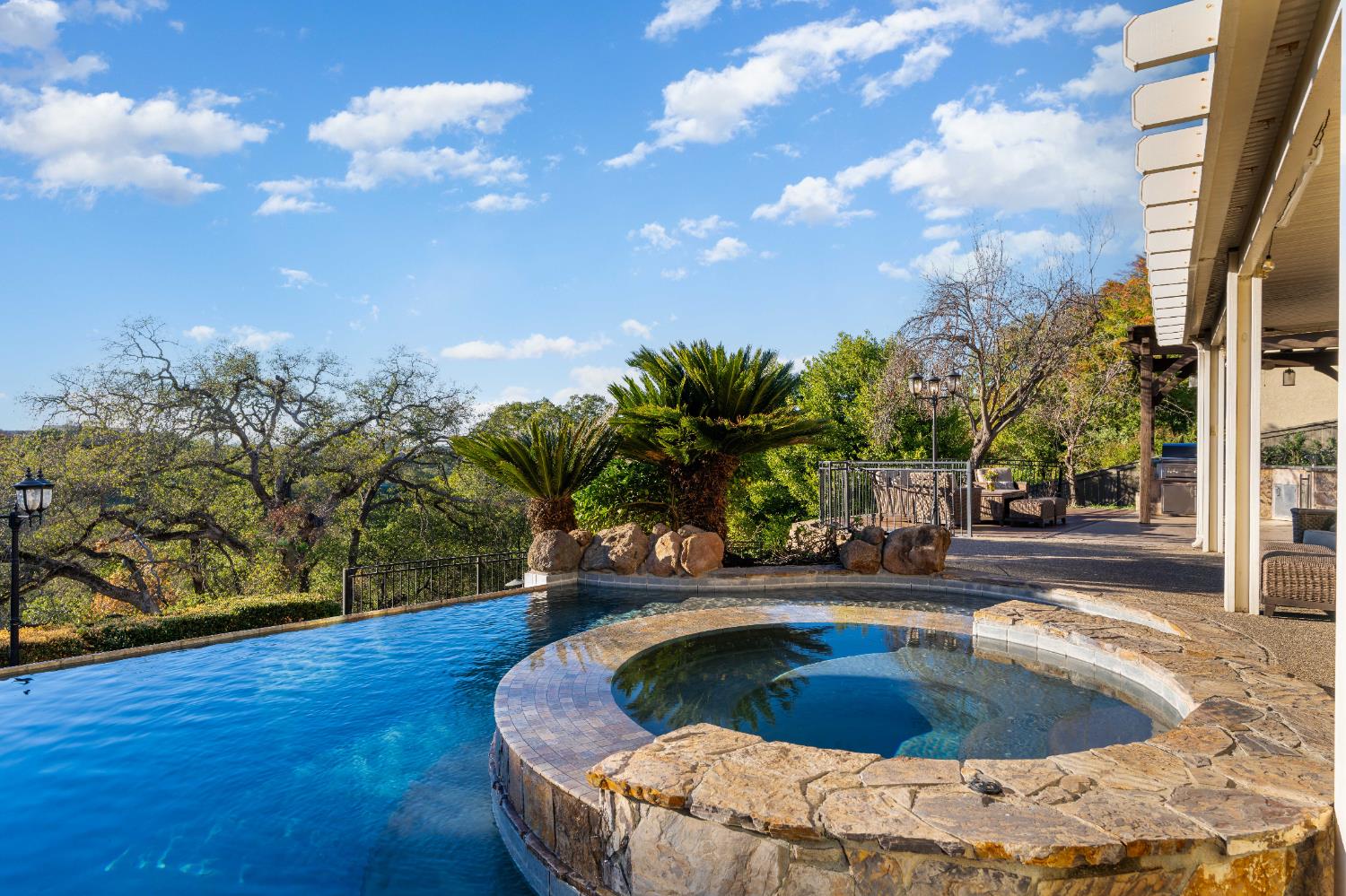1580 Vista Ridge Way Roseville, CA 95661 - Photo 53 of 58 a swimming pool with trees in the background
