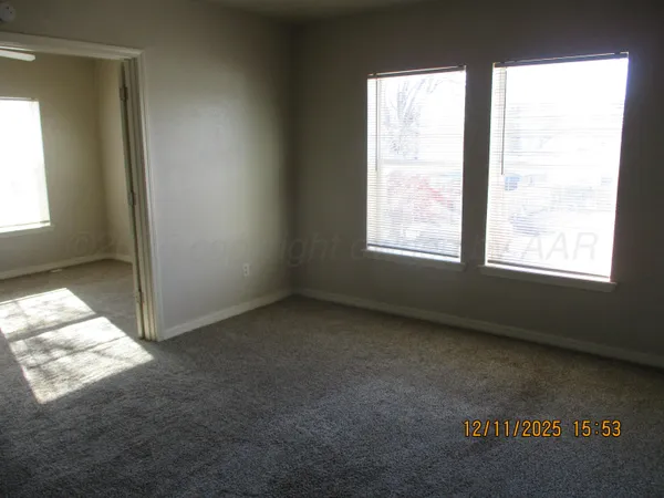 a view of an empty room and window