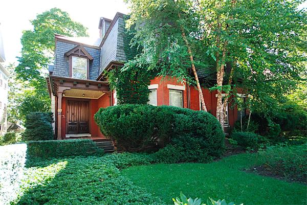 87 Perry Street Brookline, MA 02446 - Photo 1 of 12 a front view of a house with a garden