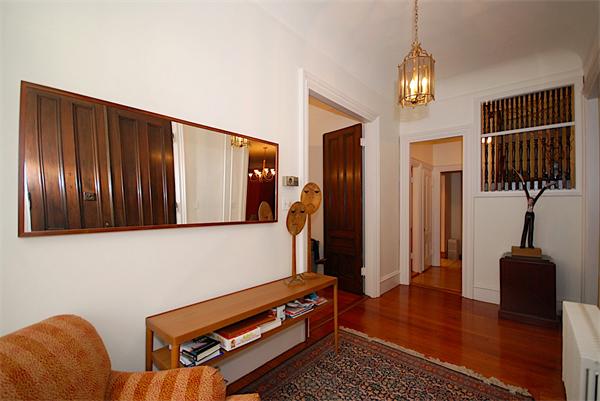 87 Perry Street Brookline, MA 02446 - Photo 2 of 12 a living room with furniture rug and a window