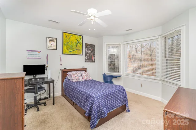 a bedroom with a bed and furniture